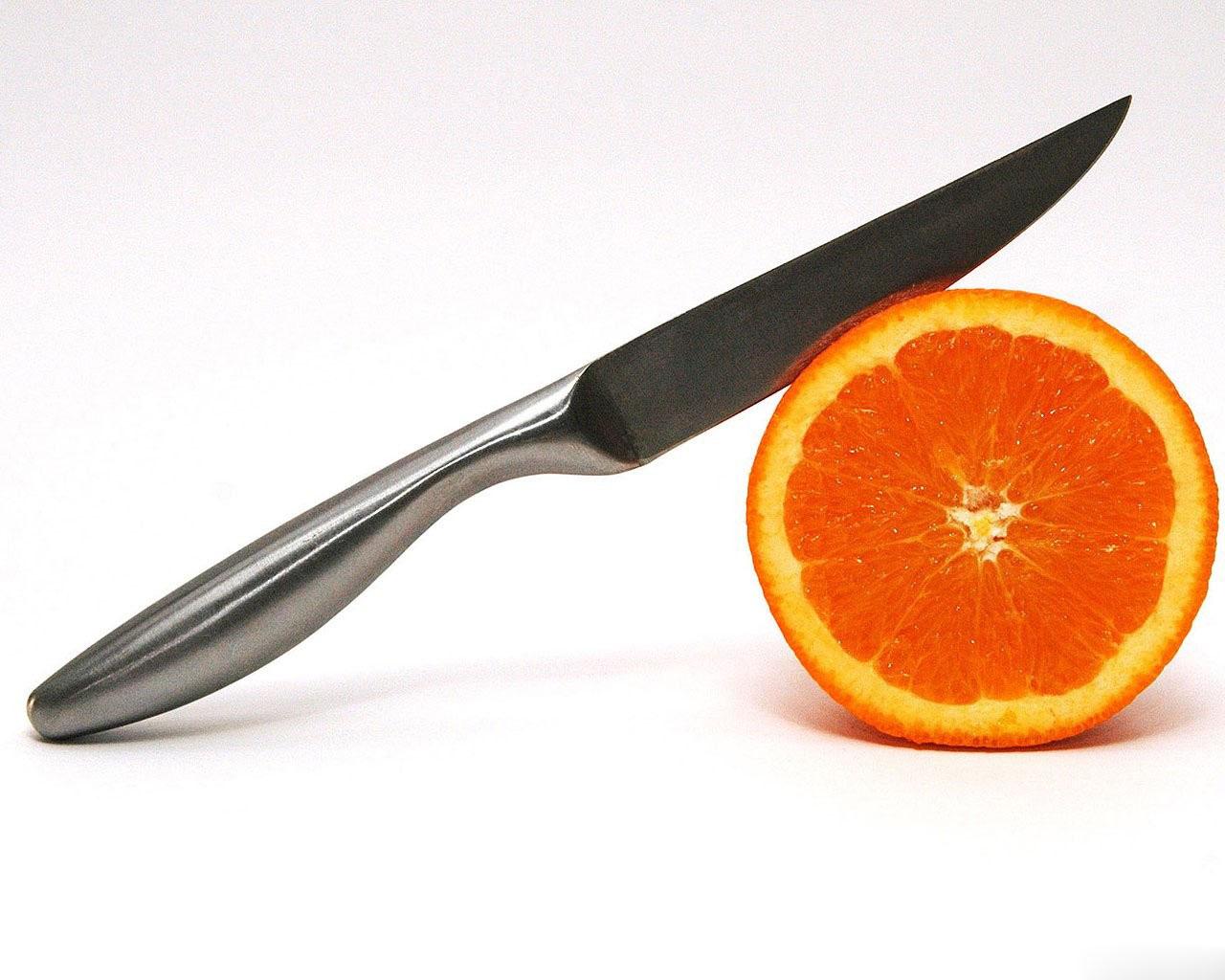 Обои Нож и апельсин 1280x1024